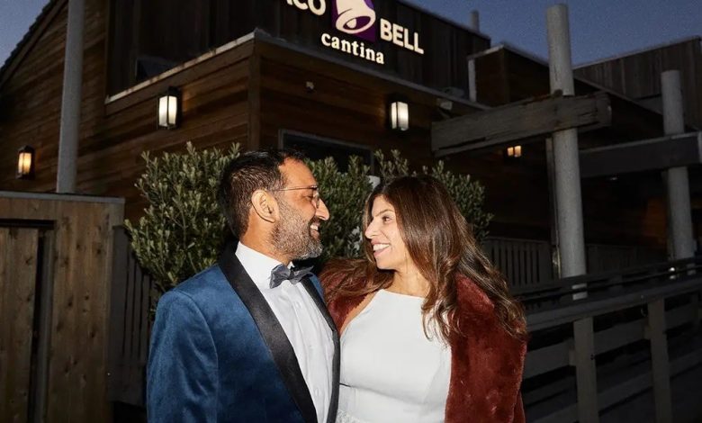 Sheel Mohnot and Amruta Godbole in front of a real-world Taco Bell. Taco Bell